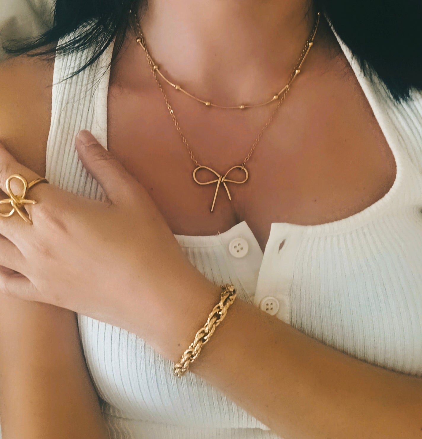 Anillo y collar lazo dorado