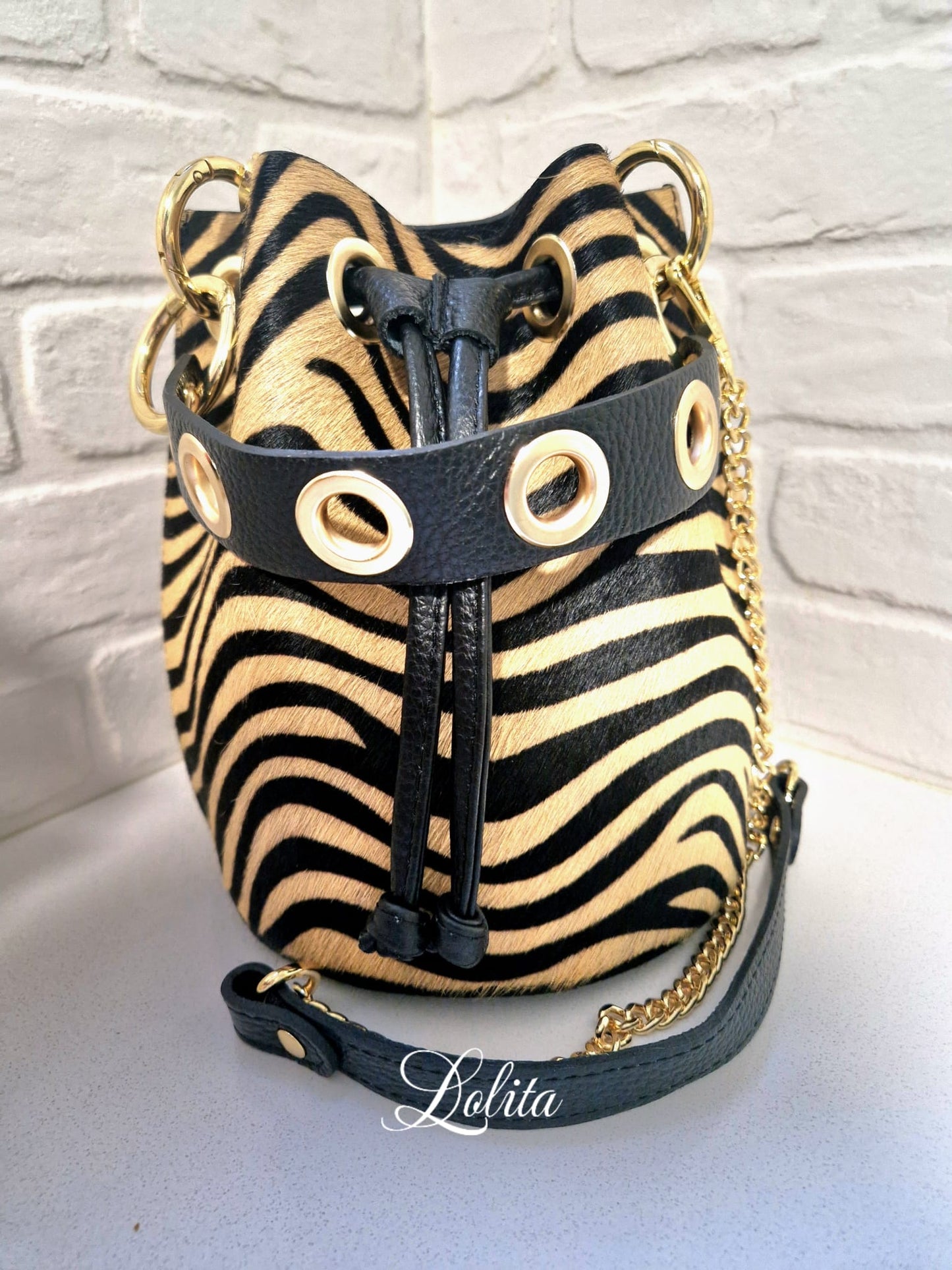 Bolso bombonera cebra, 100& piel